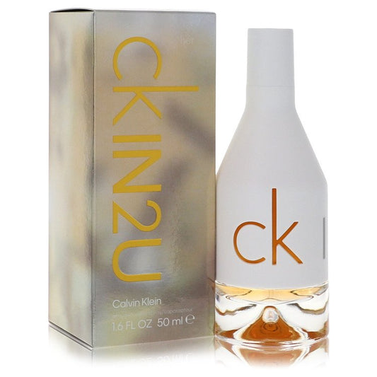 Calvin Klein CK In 2U Eau De Toilette spray bottle with sleek design and transparent cap, ready for fragrance application.