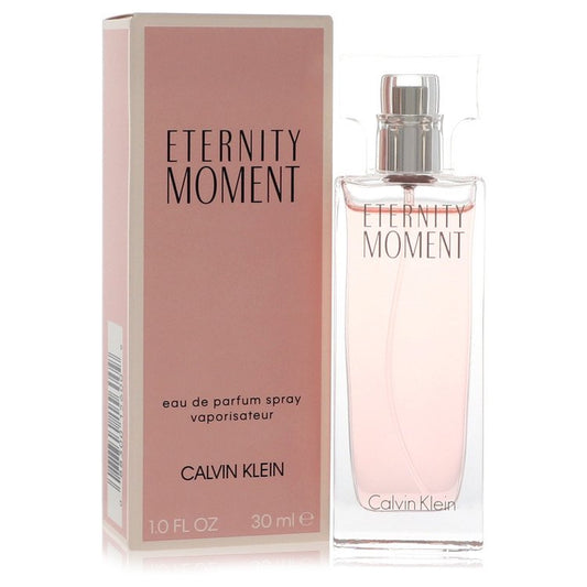 Calvin Klein Eternity Moment Eau De Parfum Spray bottle with elegant design and floral accents in the image.